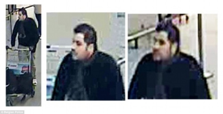 在逃嫌疑人身穿白色夹克、白色T恤、戴黑帽，手推行李车的他与其他两名嫌疑人一起在机场。据悉，其他两名嫌疑人已在机场自杀式爆炸袭击中死亡。 